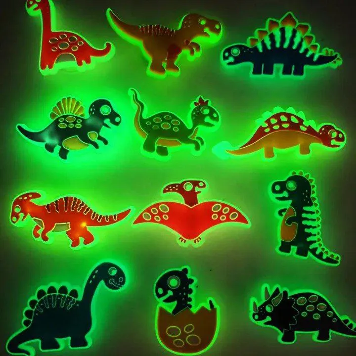 Pines de dinosaurios luminosos